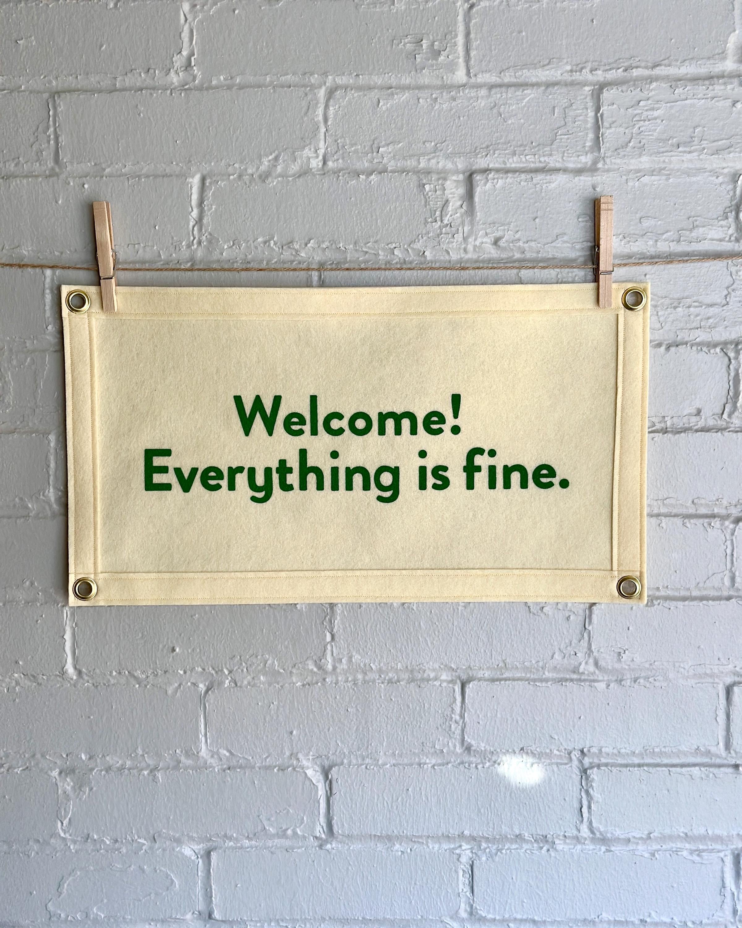 Cream felt banner with green lettering referencing The Good Place reading "Welcome! Everything is fine."