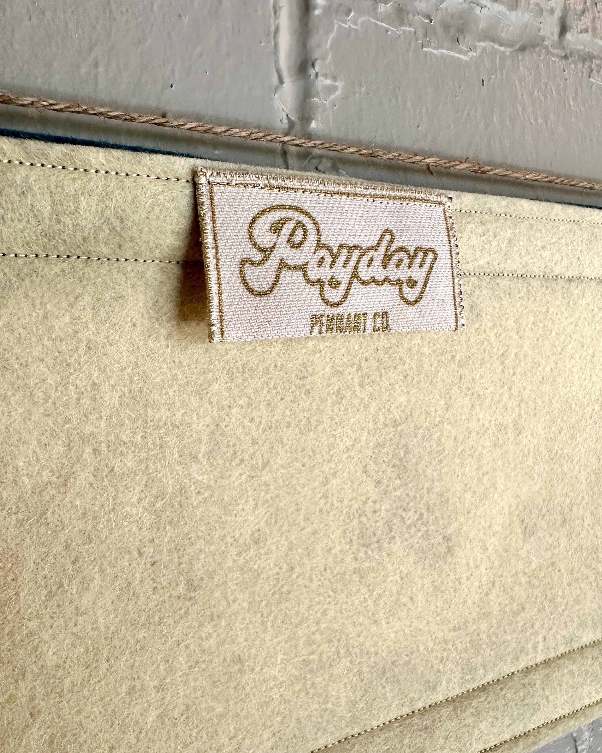 Close up view of a Payday Pennant Company tag sewn into a felt banner