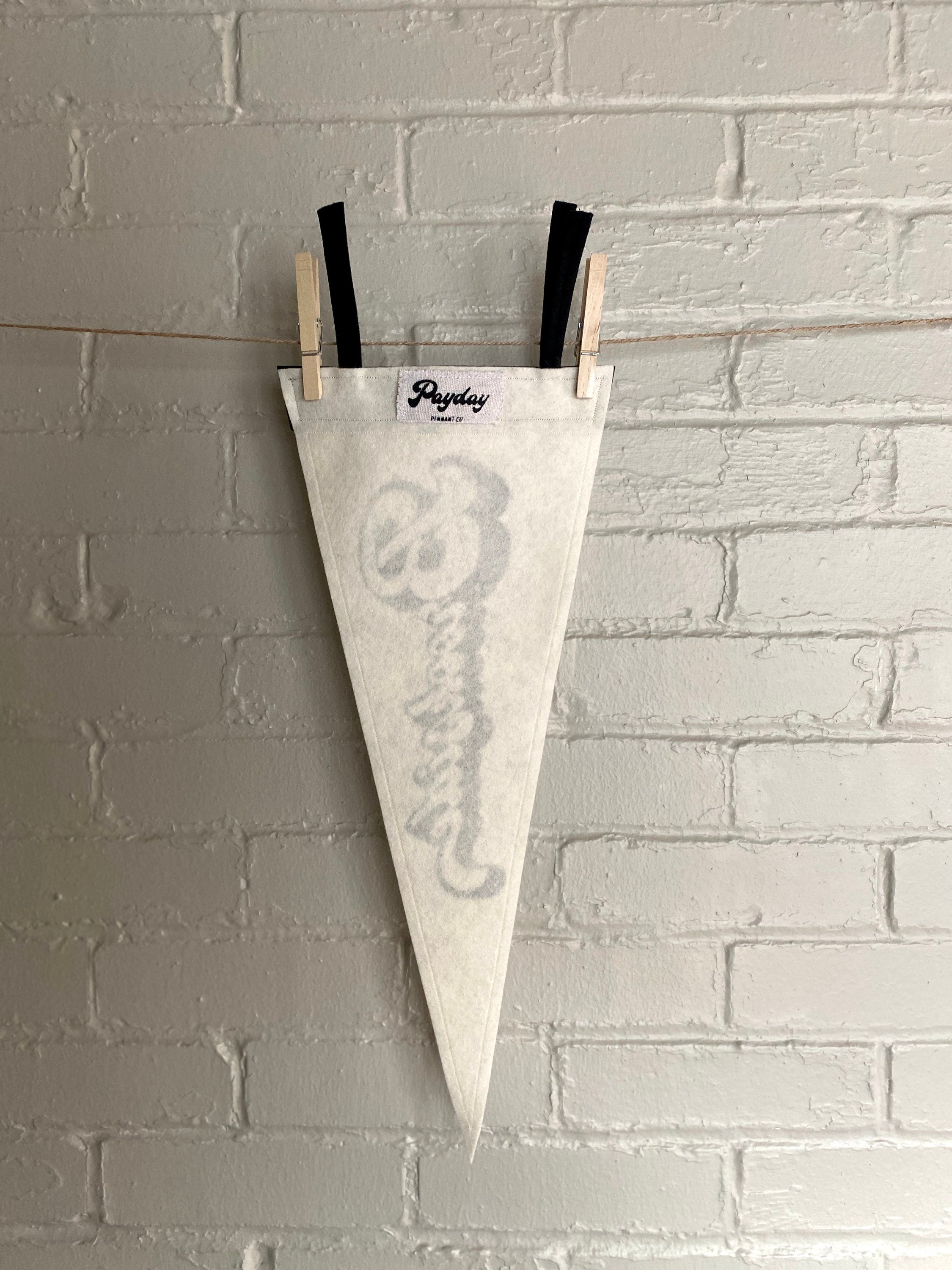 The back of a black and white pennant and "Brookside" printed on