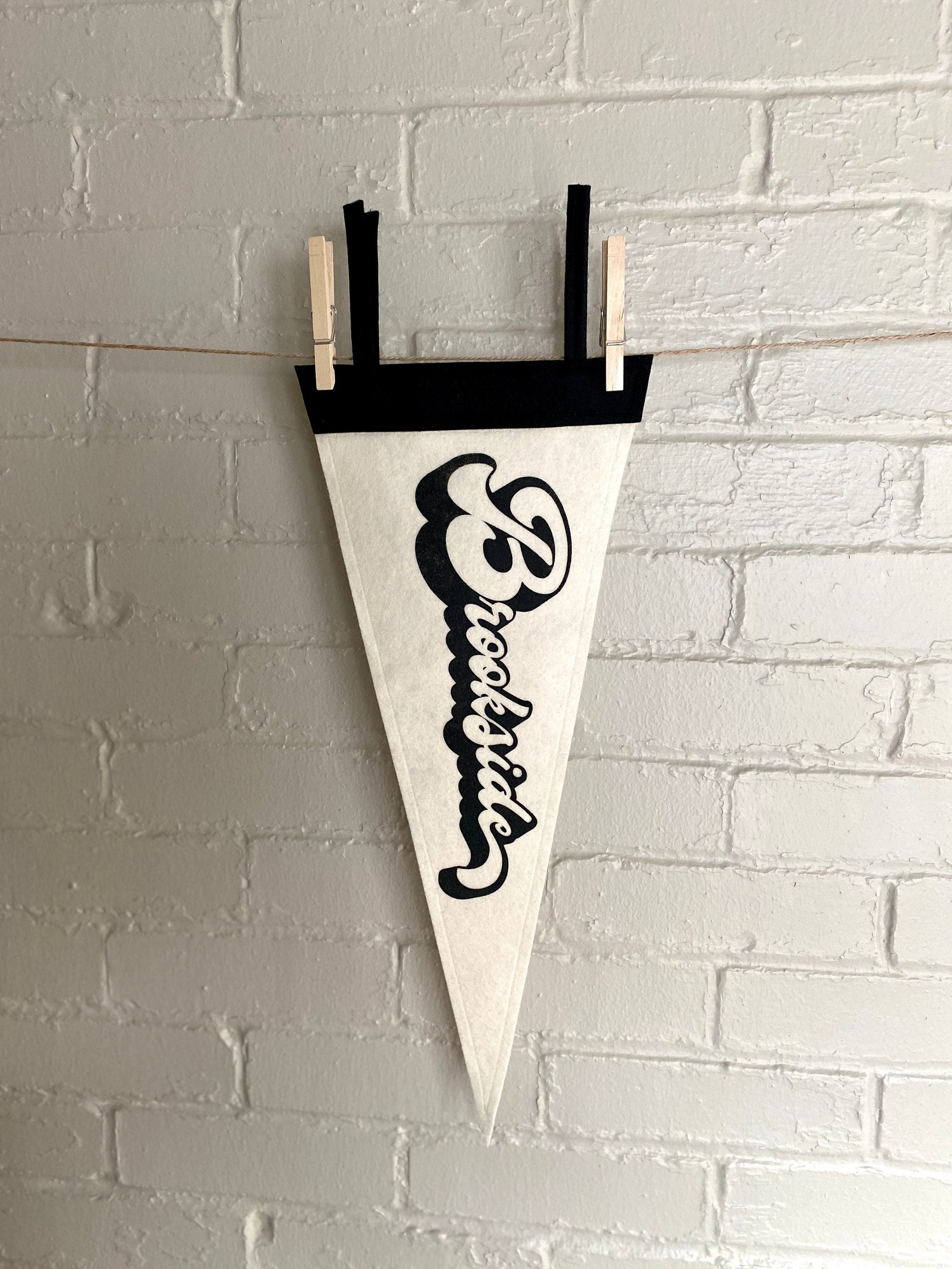 A black and white pennant and "Brookside" printed on