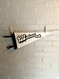 A black and white pennant that reads "Midtown" with the pennant horizontal