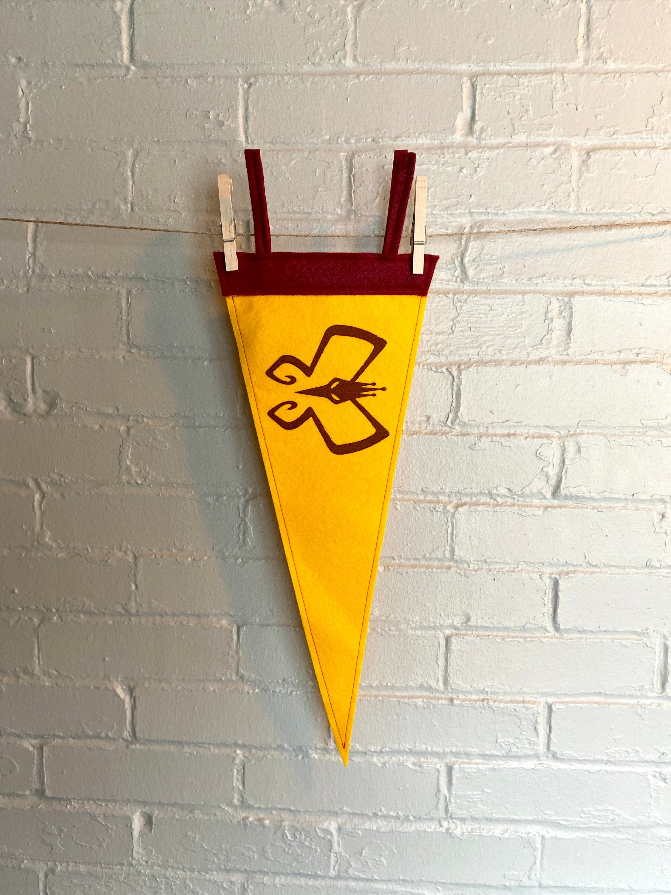 Yellow pennant with burgundy trim and the Monarch's insignia from the Venture Bros printed in burgundy ink